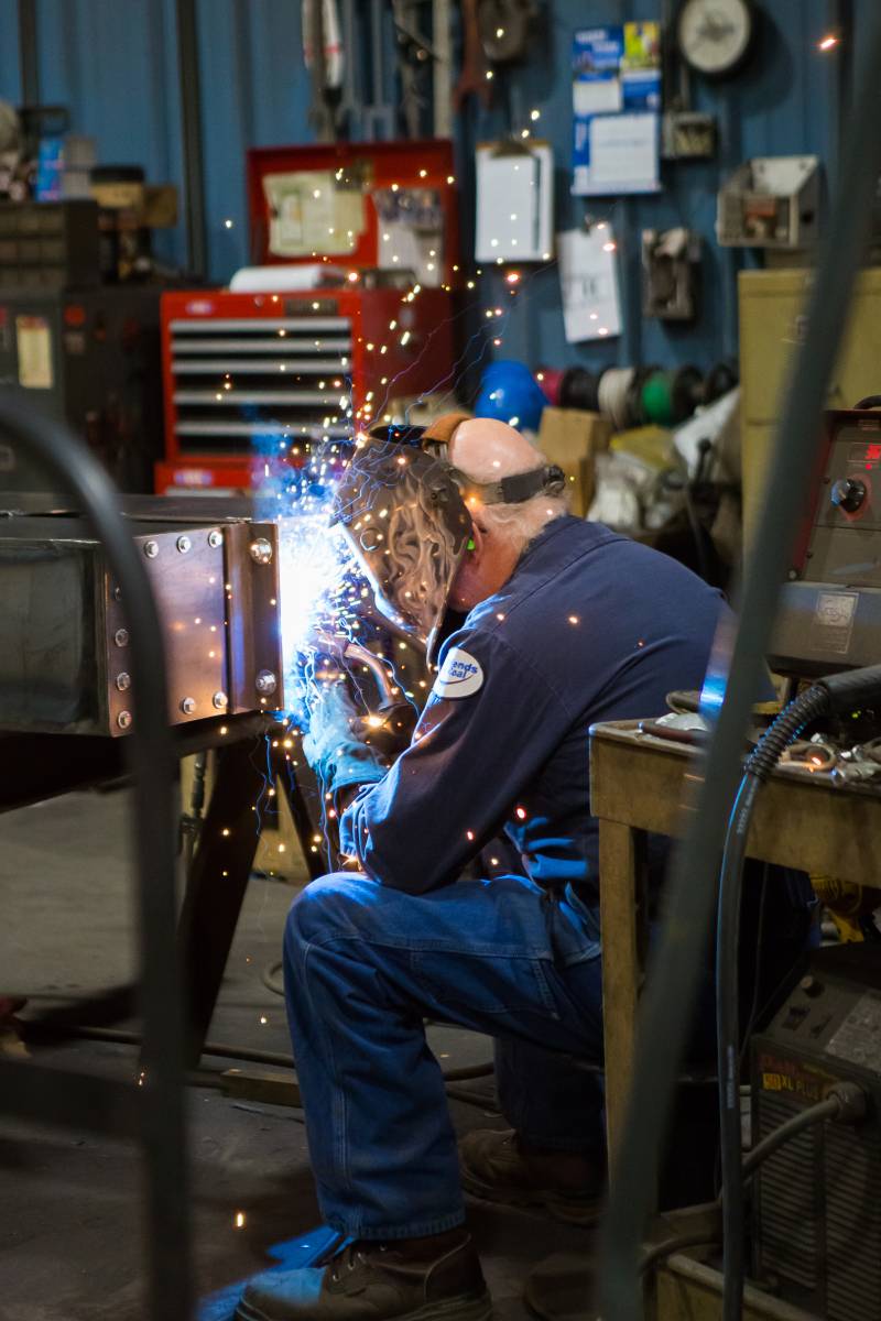 West River Coneyors' employee works on a steel fabrication project